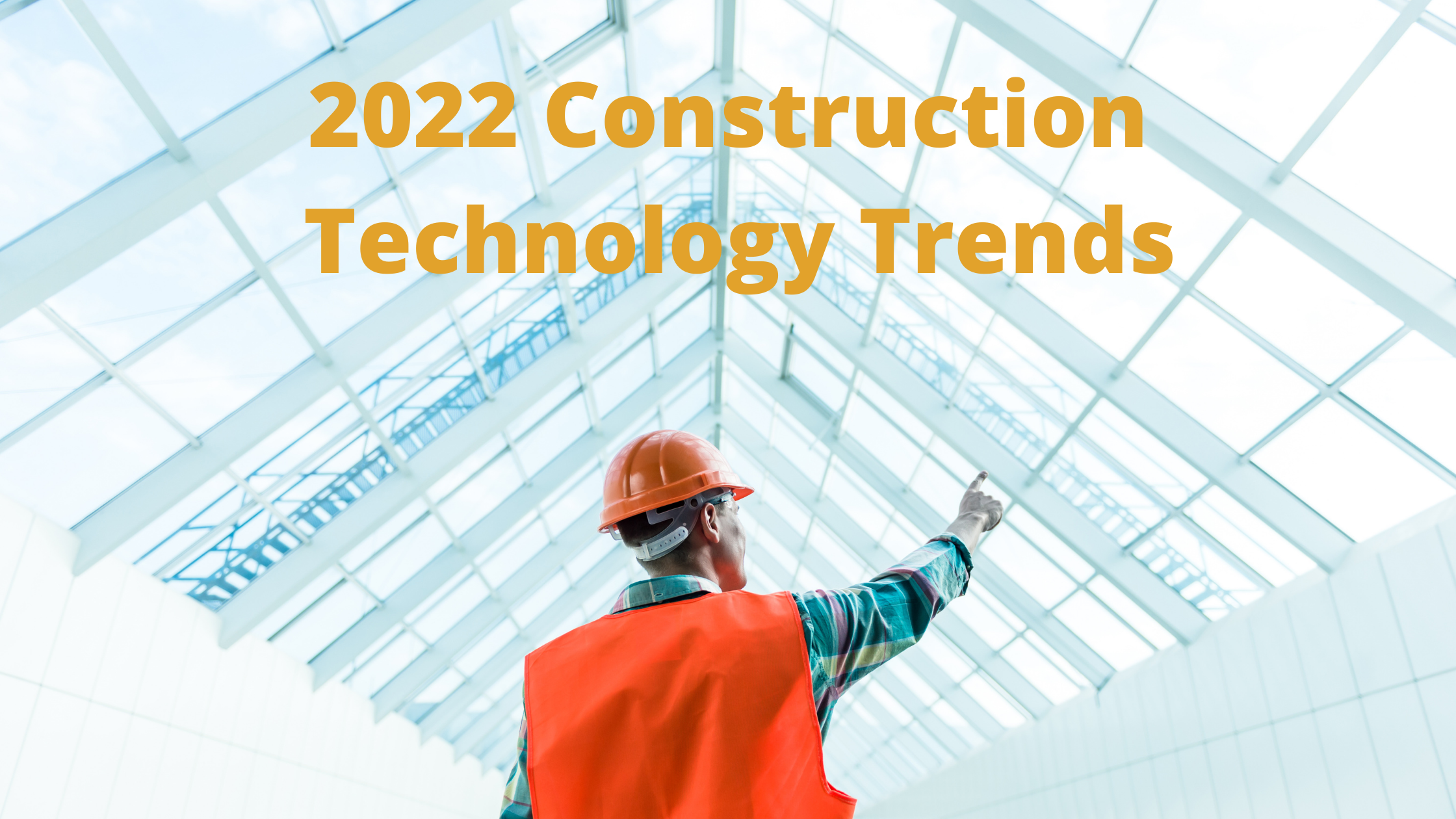 Construction worker standing beneath a building with the words “2022 Construction Technology Trends” superimposed over the top of the image.