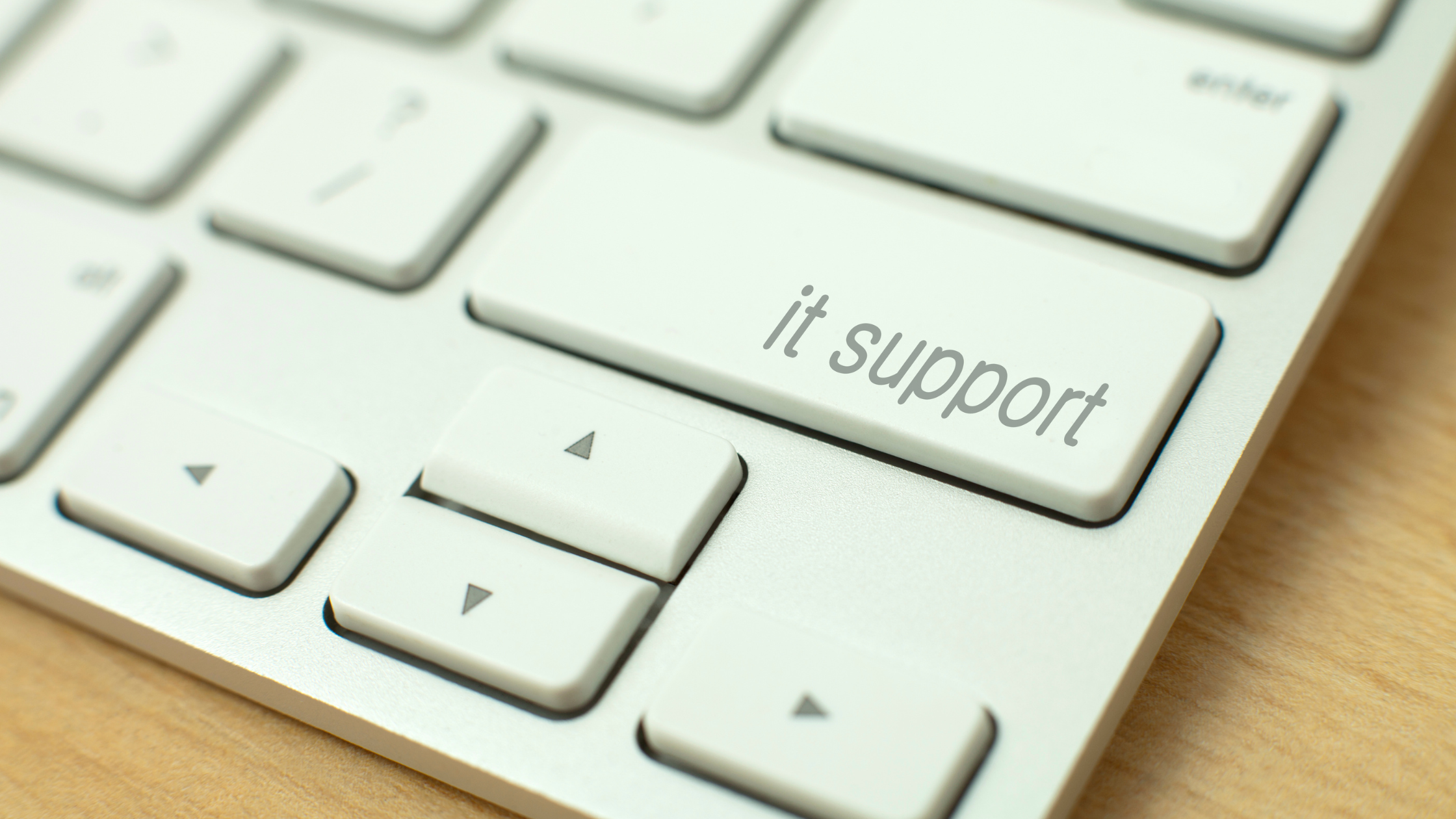 Keyboard with IT support written on the enter or return key.